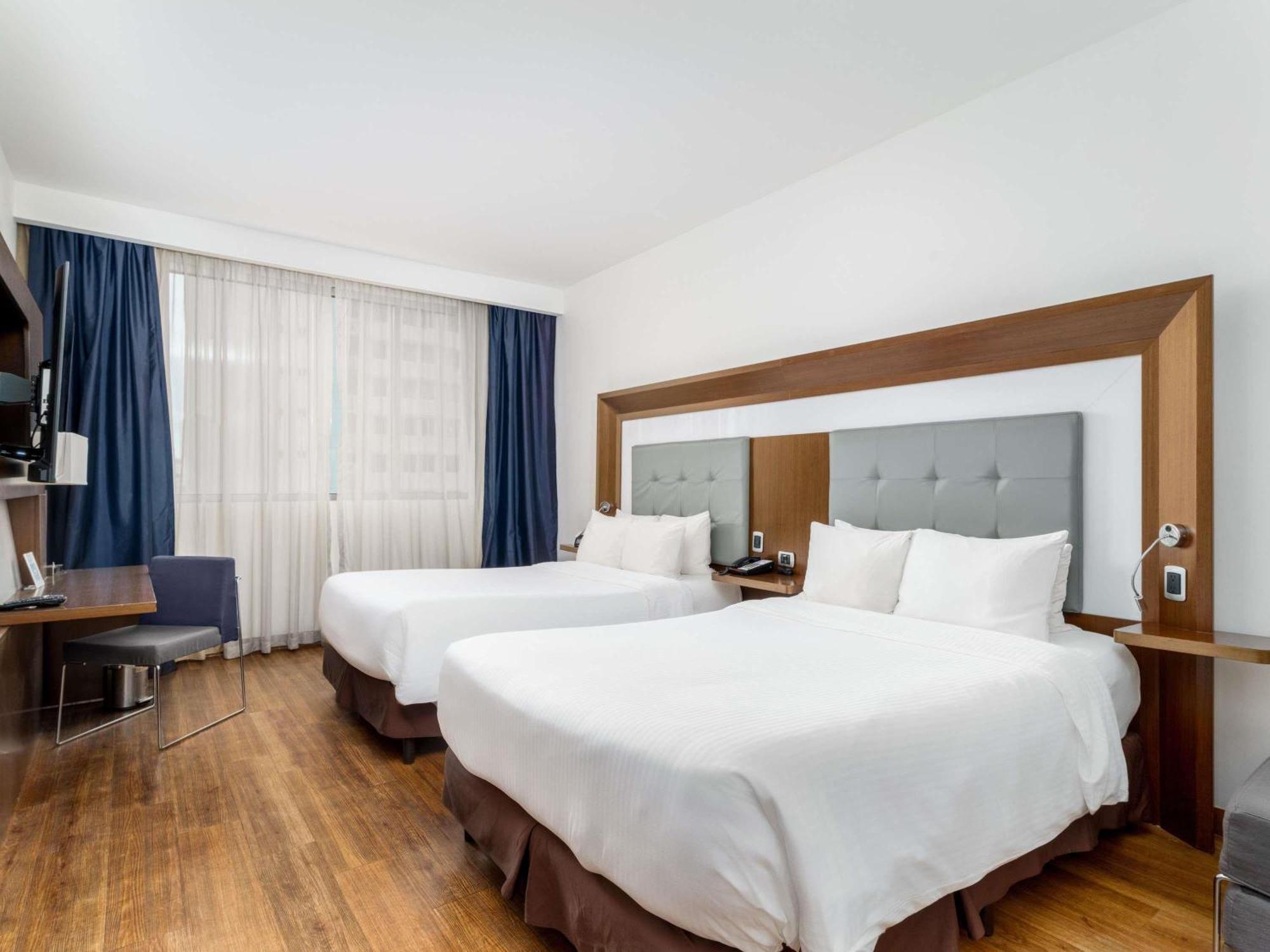 Executive Room Two Double Beds Sofa Bed