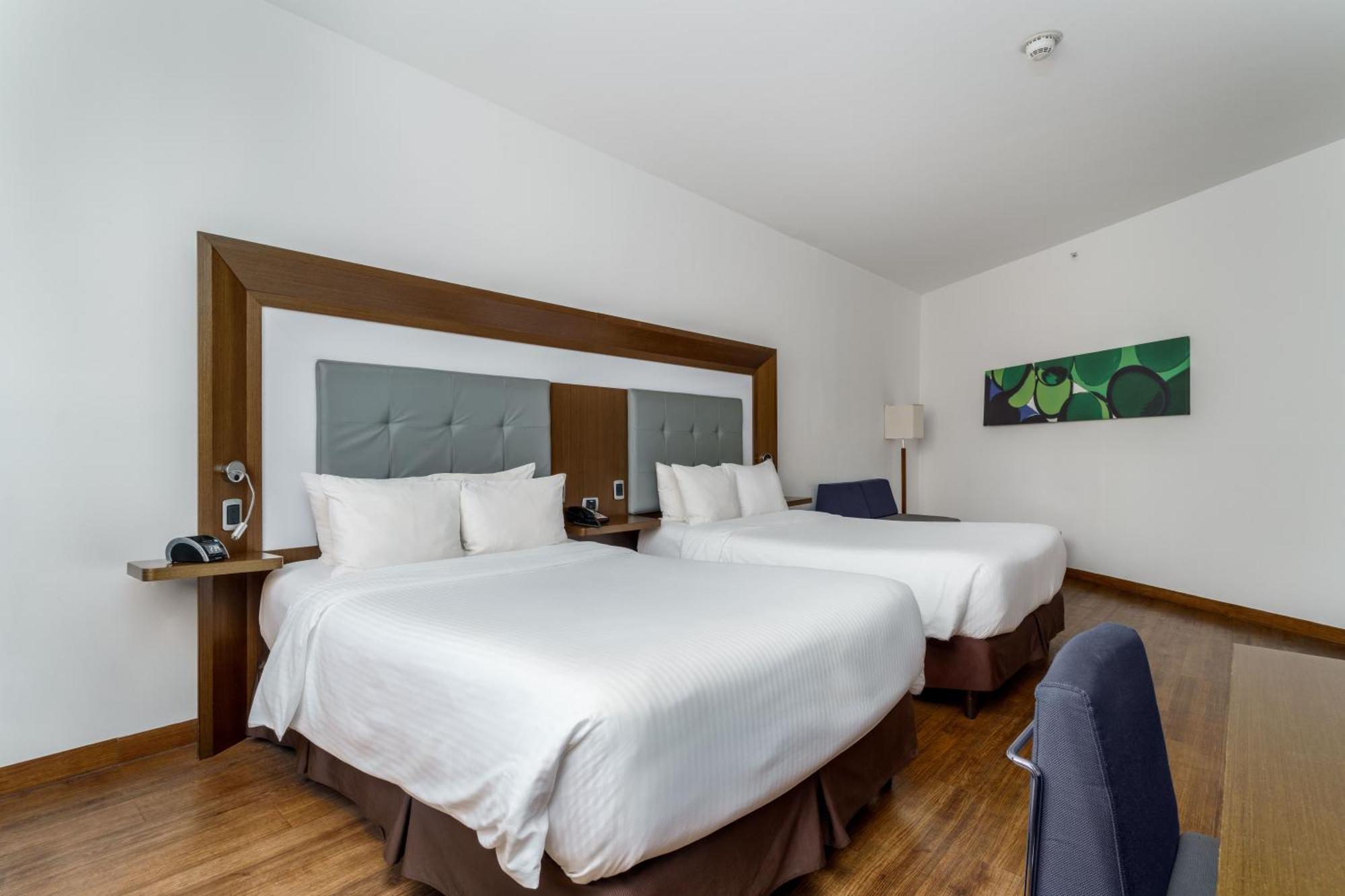 Executive Room Two Double Beds Sofa Bed