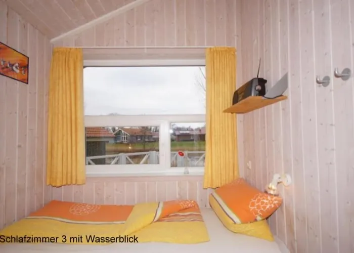 6 Personen Ferienhaus mit privatem Bootsteg, direkter Seelage, Kanu, Whirlpool und Sauna in Otterndorf